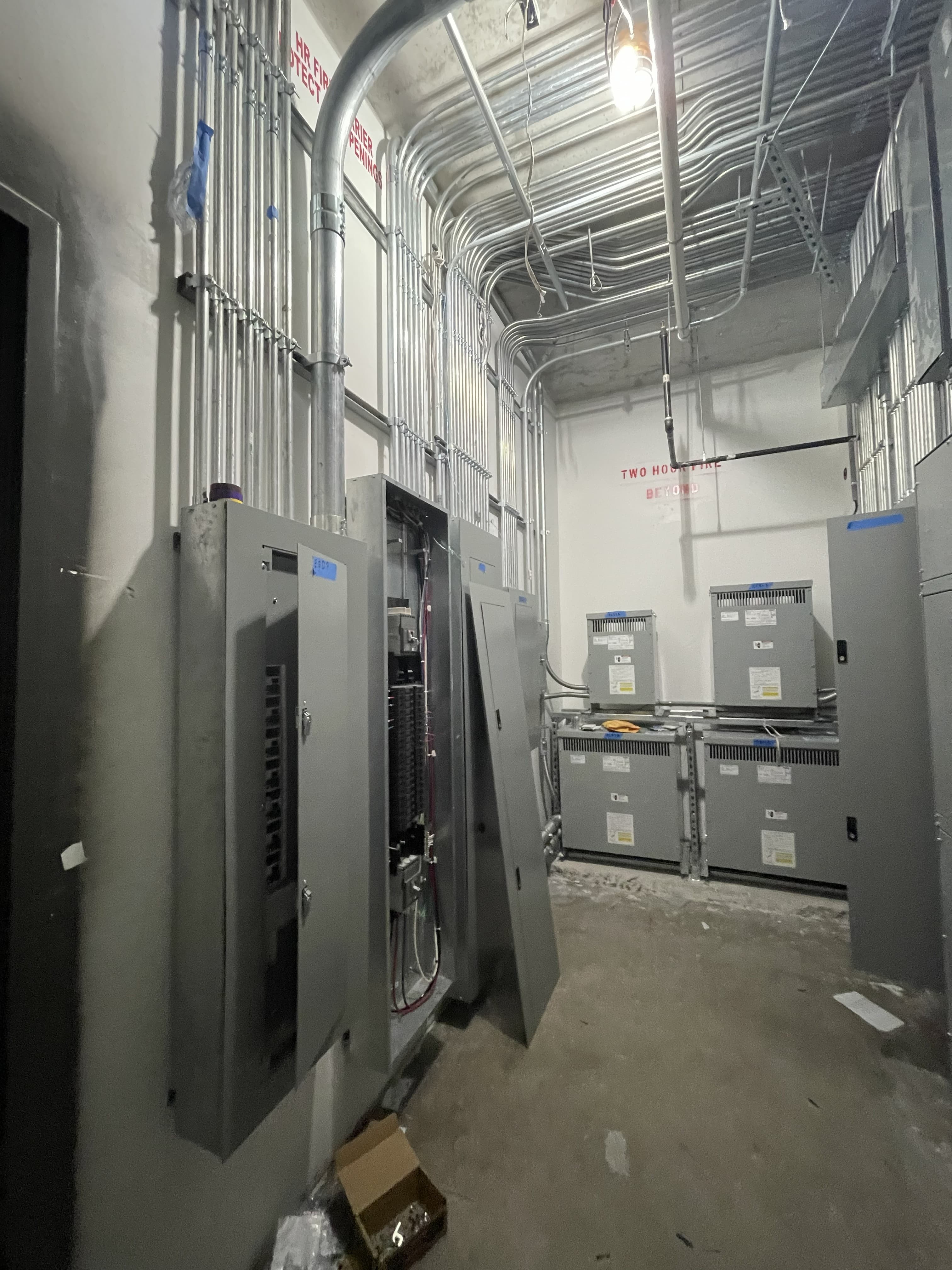 Electrical switchgear, transformers and conduit routing in a commercial electrical room