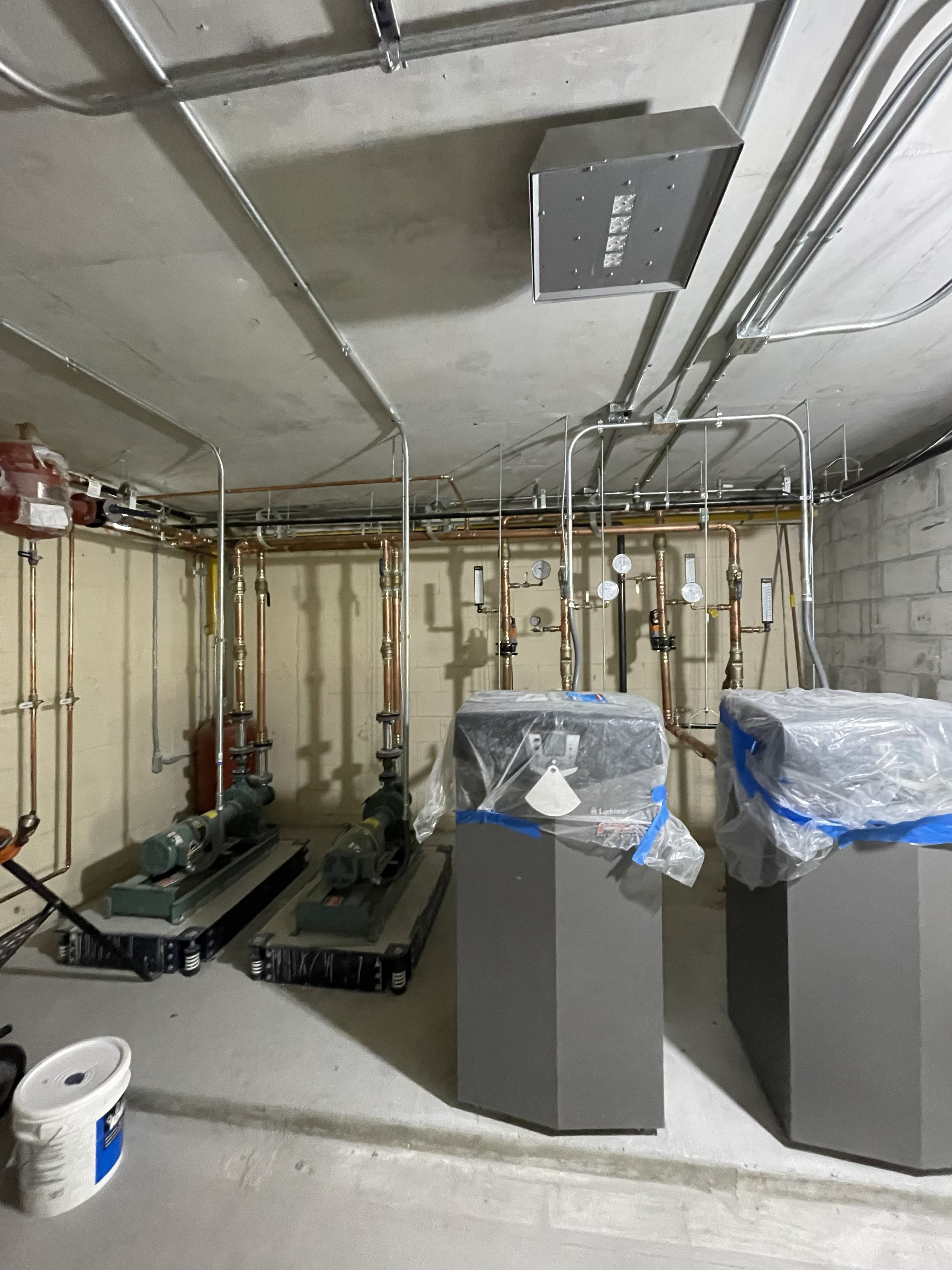 Mechanical room with piping, pumps and electrical infrastructure